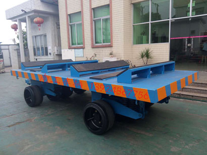 1676945614298804.jpg 30吨重型铁皮卷圆桶专用平板车2I.jpg